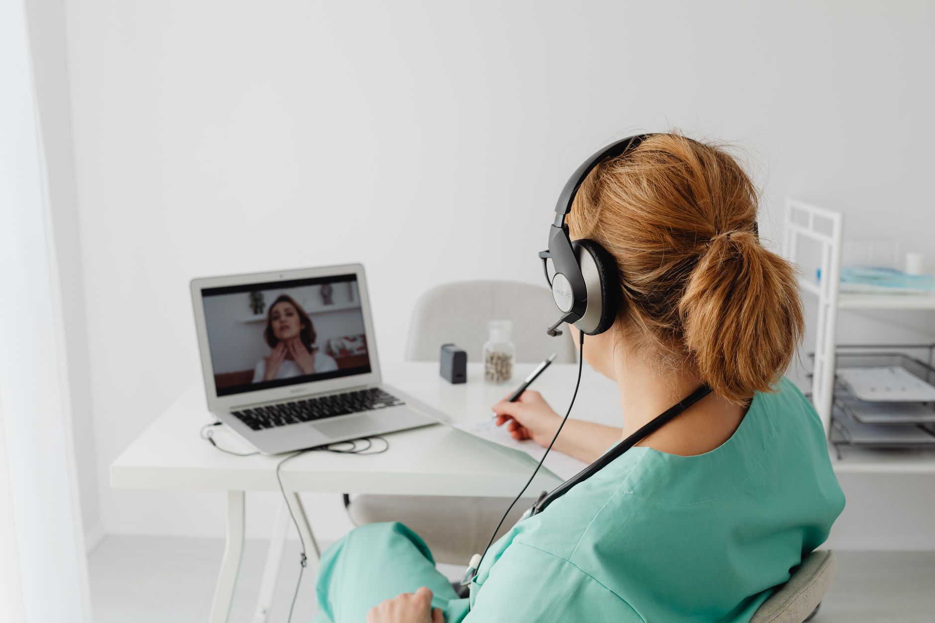 Provider conducting a telehealth appointment, one of the hybrid visit options at Providence Holistic Healing in Northern California
